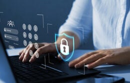 Person typing on computer with overlay of security features