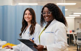 students working at a computer at UC Irvine Health
