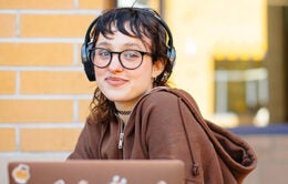 Student working at a laptop