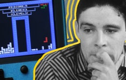 Worried man next to a vintage Game Boy