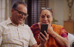 Man and woman looking at a cellphone