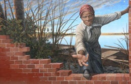 Harriet Tubman reaching out an outstretched arm
