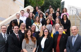 CUCSA representatives standing on stairs