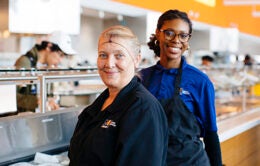 women working in a dining hall at UC Merced