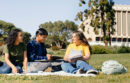 UC Irvine students sitting on the grass