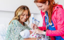 A new mother cares for her baby at UC San Diego Health.