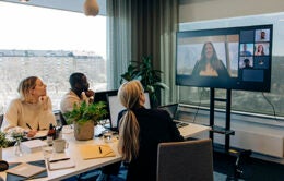 People participating in a hybrid meeting