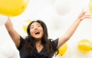 Girl holding balloons