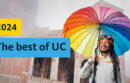 UCLA student holding a multicolored umbrella. 