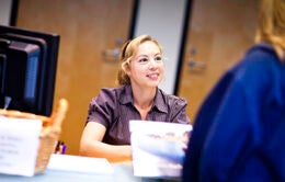 Administrative assistant talking to a client