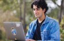 Man working outside on a laptop