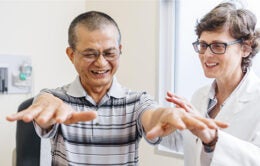 A doctor at UC Irvine Health evaluates a patient