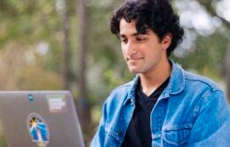 Man working outside on a laptop