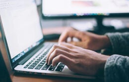 Hands typing on keyboard