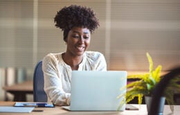 Woman working on laptop in office