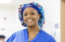 Smiling nurse wearing a colorful hairnet