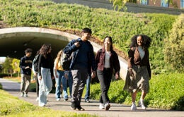 Students walking in Aldrich Park, UC Irvine