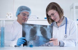 Doctors reviewing an X-ray of lungs