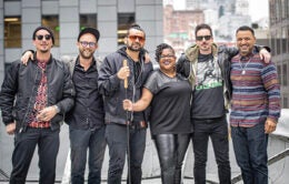 Band members posing in front of the Franklin building