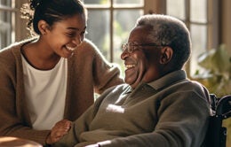 Young woman holding older man's hands