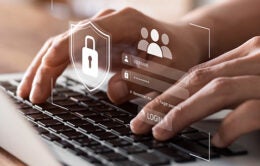 Person entering their login and password into a website