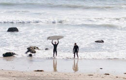Two men surfing in San Diego