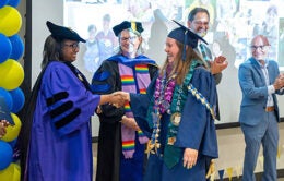 Group of people in academic gowns celebrating