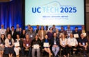 Group of people sitting together holding certificates
