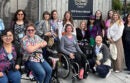 Group of people standing or sitting in wheelchairs together in front of the SF Disability Cultural CenterCredit: UC Berkeley