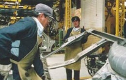 Image of people working at a manufacturing plant