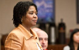 Person standing in front of a group of people