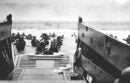 Troops dismounting their carrier at Omaha Beach in Colleville Sur-Mer, France June 6, 1944.