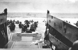 Troops dismounting their carrier at Omaha Beach in Colleville Sur-Mer, France June 6, 1944.