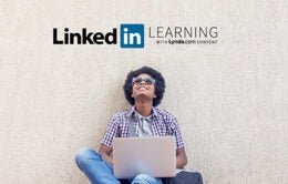 Man looking up at LinkedIn Learning sign