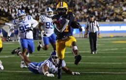 Cal football players during a game