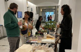 Staff chat at the summer 2025 craft fair