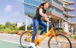 Student riding an electric bike at UCSD