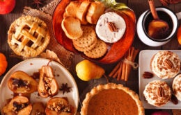 Autumn food concept. Selection of pies, appetizers and desserts. Top view table scene over a rustic wood background.