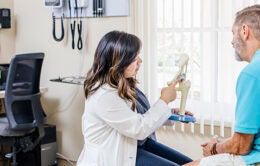 Man talking with his doctor at UCR Health Palm Desert Family Medicine.