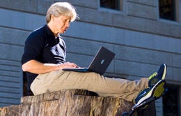 Man working on a laptop outside