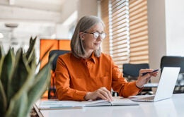 Woman working on a computer at her desk