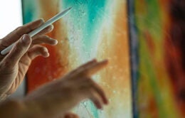 Scientists evaluating zoomed-in medical tissue on a digital screen