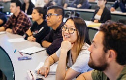 Students paying attention to instructor in UC lecture hall