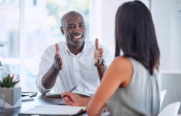 Manager speaking with employee