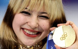 Alysa Liu holding her gold medal