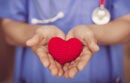 Doctor Nurse hand giving red heart for help care or blood donation healthcare share love to fight disease concept.