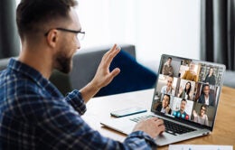 Video call, online business meeting, briefing. Successful caucasian freelancer waving hand and greeting colleagues during video conference. Distant work, online learning