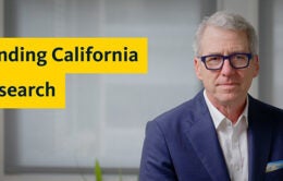 President Milliken in a blue suit + "Funding California Research"