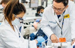 Student and professor working in lab