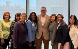 President Milliken standing with a diverse group of leaders